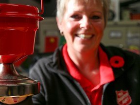 Tim Miller/The Intelligencer
Salvation Army Christmas Kettle Campaign co-ordinator, Debbie Scott, holds up a small kettle at the organization’s Pinnacle Street office on Thursday in Belleville.