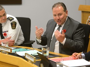 London police Chief John Pare, left, looks on as police budget chairperson Paul Paolatto speaks during Thursday?s police services board meeting. (MORRIS LAMONT, The London Free Press)