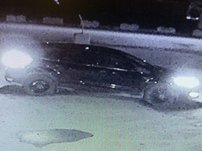 Security footage of a black Ford Escape, the occupants of which have been linked a truck theft and shooting in La Corey on Nov. 9, 2016. Supplied.