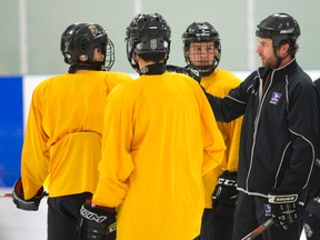 Junior Knights minor midget head coach Steve Benedetti talks to top line during a practice at the Western Fairs Sports Centre. (Free Press file photo)