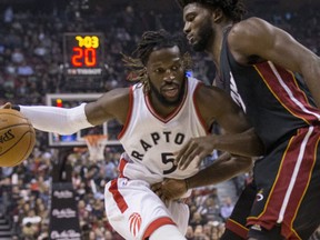 Toronto Raptors forward DeMarre Carroll drives by Miami Heat forward Justise Winslow in Toronto, Ont. on Friday November 4, 2016. (Craig Robertson/Toronto Sun/Postmedia Network)