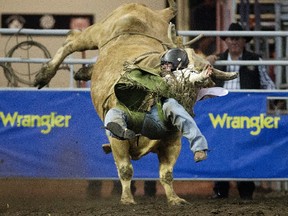 Bull Rider Tanner Girletz is bucked off Mr Sunshine during the first go-round at the Canadian Finals Rodeo at Northlands Coliseum, in Edmonton on Wednesday Nov. 9, 2016.