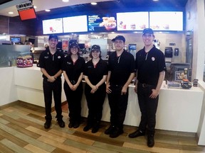 In this Oct. 6, 2016 photo, Lucas, Lauren, Lindsey, Leith and Logan Curtis, left to right, pose in the lobby of a McDonald's in Potterville, Mich. The 18-year-old non-identical quintuplets all work at the Lansing-area restaurant. (AP Photo/Mike Householder)