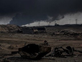 A general view of the burnt landscape, scorched by airstrikes and covered in ash and oil from burning oil wells set on fire by fleeing ISIS members on Nov. 10, 2016, in Al Qayyarah, Iraq. Many families have begun returning to their homes in recently liberated towns south of Mosul. Oil wells in the area that were set on fire by ISIS continue to burn blanketing the area in think clouds of smoke and oil. (Chris McGrath/Getty Images)