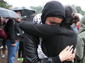 Noor Wadi, a second year law student, cries as she hugs a friend after speaking with fellow students gathered at the University of Texas at Austin to protest the Trump election on Wednesday, Nov. 9, 2016. Hundreds of University of Texas students march through downtown Austin in protest of Donald Trump's presidential victory.(Deborah Cannon/Austin American-Statesman via AP)