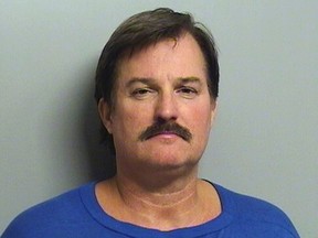 This undated file booking photo provided by the Tulsa County Sheriff's Office shows Shannon Kepler. On Friday, Nov. 11, 2016, a judge declared a mistrial after jurors couldn't agree whether to convict Kepler, a former Tulsa police officer, of first-degree murder in the 2014 fatal shooting of his daughter's boyfriend. (Tulsa County Sheriff's Office via AP, File)