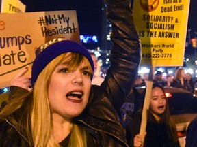 Anti-Trump protesters march from the Washington Monument to Inner Harbor Thursday, Nov. 10, 2016, in Baltimore. Scattered protests around the country continue to follow the unexpected election of Donald Trump as president, with hundreds marching in Philadelphia, Baltimore and Grand Rapids, Mich. (Loyd Fox/The Baltimore Sun via AP)