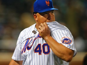 Pitcher Bartolo Colon of the New York Mets reacts while walking off the mound after giving up a two-run home run in the fourth inning against the Cincinnati Reds during a game at Citi Field on April 26, 2016. (Rich Schultz/Getty Images)