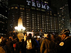 Protesters gather in downtown Chicago as they protest the election of President-elect Donald Trump, Thursday, Nov. 10, 2016. Two days after Trump's election as president, the divisions he exposed only showed signs of widening as many thousands of protesters flooded streets across the country to condemn him. (AP Photo/Nam Y. Huh)