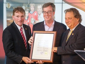 Senators president Cyril Leeder (left), Ottawa Mayor Jim Watson (centre) and Senators owner Eugene Melnyk. (Darren Brown, Postmedia Network file)