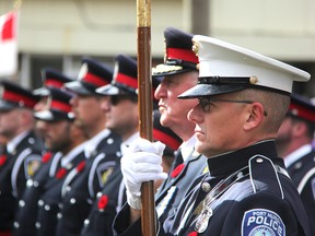 Sgt. Doug Decker of the Port Huron Police, stands next to Sarnia Police Chief Phil Nelson during the Remembrance Day ceremony in Sarnia Friday. (Tyler Kula/Sarnia Observer)