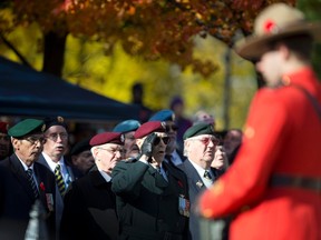 A group of veterans sing O' Canada during a Remembrance Day ceremony at the Cenotaph in Victoria Park in London, Ont. on Friday November 11, 2016. (CRAIG GLOVER, The London Free Press)