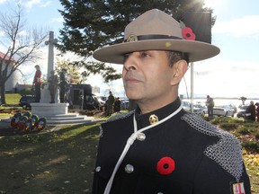 Tushar Bendre, wearing the uniform of Countess Mountbatten's Own Legion of Frontiersmen, attends a Remembrance Day service at the Cross of Sacrifice in Kingston on Friday. (Michael Lea/The Whig-Standard)