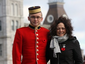 Officer Cadet Connor Bobbitt and his mother Monica Bobbitt following the Remembrance Day ceremony at Royal Military College on Friday. Lt.-Col. Daniel Bobbitt was killed in a May 2014 training accident at Wainwright Garrison in Alberta. (Steph Crosier/The Whig-Standard)