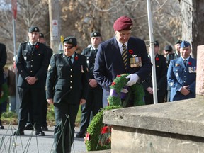 Michael Baldree lays a wreath during the Remembrance Day ceremony in Wilton on Friday. (Elliot Ferguson/The Whig-Standard)