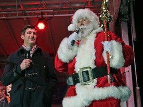 It was beginning to look a lot like Christmas at the annual Downtown Business Association Holiday Light Up on November 14, 2015. The event included fireworks, mascots, clowns, stilt walkers, food trucks and musical entertainment. Edmonton Mayor Don Iveson (left) welcomed Santa from the North Pole to officially light the 72 foot Christmas tree in front of City Hall. Larry Wong / Postmedia