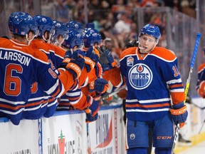 Tyler Pitlick celebrates his first-period goal Friday at Rogers Place. (The Canadian Press)