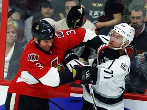 Ottawa Senators' Marc Methot battles with Los Angeles Kings' Jeff Carter during second period NHL hockey action in Ottawa Friday, November 11, 2016. (THE CANADIAN PRESS/Fred Chartrand)