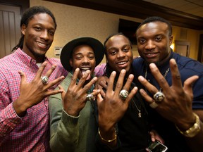 Shakir Bell, second from left, shows off his Grey Cup ring with his teammates after the presentation ceremony in May. (David Bloom)