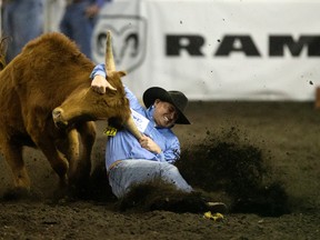 Brendan Laye competes in Steer Wrestling on Day 2 of the Canadian Finals Rodeo on Thursday at Northlands Coliseum. (David Bloom)