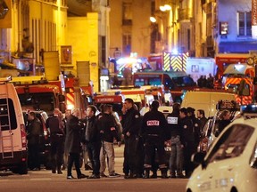 This file photo taken early on Nov. 14, 2015 shows Police forces, firefighters and rescue workers secure the area near the Bataclan concert hall in central Paris, following a series of coordinated attacks in and around Paris late on Nov. 13, 2015.  (Francois Guillot/Getty Images)