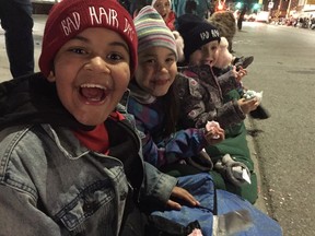 Do kids still love the Santa Claus Parade? Just ask the trio (left to right) of Alex Austin-Greham, Oceanah Burdon, and Raymond Hitchings at London's version of the annual tradition, which kicked off the Christmas season on Saturday. Patrick Maloney/The London Free Press