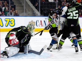 The Edmonton Oil Kings'Patrick Dea and Lane Bauer stop the Kootney Ice's Zak Zborosky during second period WHL action against the Kootenay Ice at Rogers Place, in Edmonton on Saturday Nov. 12, 2016.