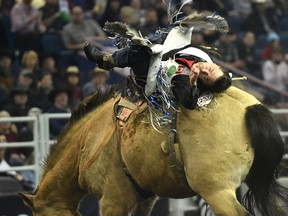 Caleb Bennett from Utah in the bareback riding competition during the matinee of the Canadian Finals Rodeo at Northlands Coliseum in Edmonton, Saturday, November 12, 2016.