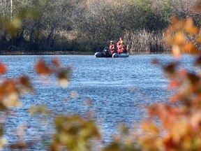 The search continues in and around the water for a missing canoeist in London, Ont. on Sunday November 13, 2016. Police were called to North Pond, near where Pond Mills Rd. meets Southdale Rd., at about 3 a.m. Craig Glover/The London Free Press/Postmedia Network