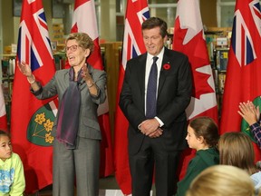 Mayor John Tory and Premier Kathleen Wynne are pictured together at a recent public event. (STAN BEHAL, Toronto Sun)