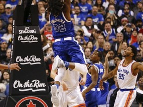 Raptors centre Lucas Nogueira slams home a dunk during Saturday's win over the Knicks. Jack Boland/Postmedia