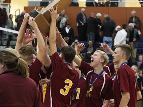 Regiopolis-Notre Dame Catholic High School celebrates after defeating Kingston Collegiate and Vocational Institute in straight sets to win the Kingston Area Secondary Schools Athletic Association senior boys volleyball finals at the Queen's Athletics and Recreation Centre in Kingston, Ont. on Sunday November 13, 2016.  Steph Crosier/Kingston Whig-Standard/Postmedia Network