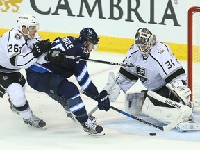 Winnipeg Jets center Mark Scheifele (c) has a scoring attempt thwarted by Los Angeles Kings center Nic Dowd (l) and Kings goalie Peter Budaj during NHL hockey in Winnipeg, Man. Sunday November 13, 2016.
Brian Donogh/Winnipeg Sun/Postmedia Network