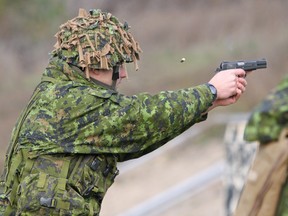 Pte. William Fyfe of the Princess of Wales Own Regiment takes part in the pistol marksmanship event while trying to earn his second German Armed Forces Badge for Military Proficiency at CFB Kingston on Saturday. (Steph Crosier/The Whig-Standard)
