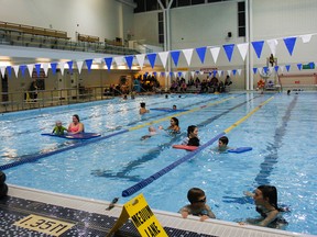 Children, parents and instructors take part in a SwimAbility Kingston session at Queen's Athletics and Recreation Centre on Nov. 2. (Julia McKay/The Whig-Standard)