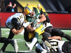 Eskimos RB John White ran for 160 yards on 20 carries during Sunday's win over the Tiger-Cats in Hamilton. (The Canadian Press)