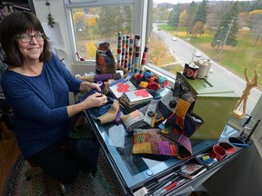 Artist Theresa English works in her London studio making fibre art using the Japanese technique called sashiko boro. Her work will be part of the Fibre Art Festival. (MORRIS LAMONT, The London Free Press)