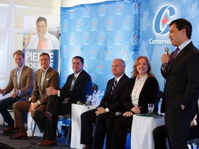 From left to right, Chris Alexander, Maxime Bernier, Andrew Scheer, Erin O'Toole and Lisa Rait look on as Conservative leadership candidate Michael Chong responds to questions from the audience at a Conservative leadership debate in Greely, Ont., on Sunday, November 13, 2016. THE CANADIAN PRESS/Fred Chartrand