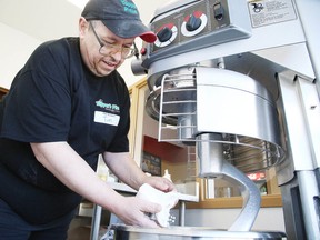 Tim Laundry, a dough maker at Topper's Pizza, prepares to make some dough on Nov. 9. A new location on Barrydowne Road opened its doors on Oct. 17. (Gino Donato/Sudbury Star)