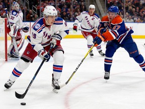 Connor McDavid chases Rangers' Jesper Fast in the New York end during Sunday's game at Rogers Place. (David Bloom)