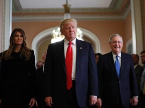 President-elect Donald Trump and his wife Melania walk with Senate Majority Leader Mitch McConnell of Ky. after a meeting on Capitol Hill on Nov. 10, 2016. THE CANADIAN PRESS/AP, Alex Brandon