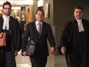 Former Montreal mayor Michael Applebaum, who is charged with various fraud-related counts, arrives at the courthouse accompanied by his lawyers Monday, November 14, 2016 in Montreal. THE CANADIAN PRESS/Paul Chiasson