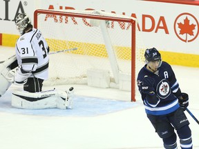 Winnipeg Jets centre Mark Scheifele celebrates his winning shot against Los Angeles Kings goalie Peter Budaj in a shootout on Sunday afternoon. (Brian Donogh/Winnipeg Sun)