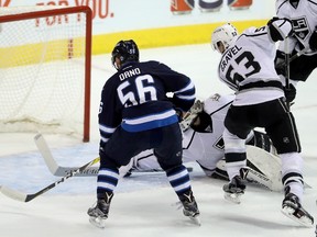 Winnipeg Jets' Marko Dano (56) fires the puck into the net past Los Angeles Kings goaltender Peter Budaj (31) during first period action on Sunday. (THE CANADIAN PRESS/Trevor Hagan)