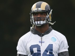 Rams defensive end Robert Quinn is in hospital with an illness that's unrelated to football. (Matt Dunham/AP Photo)