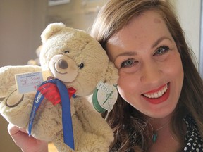 Tara McCallan, whose daughter Pip is a pediatric patient at Kingston General Hospital, holds a teddy bear that is awaiting sponsorship in the annual Auxiliary Teddy Bear Campaign in Kingston, Ont. on Monday, Nov. 14, 2016. The campaign raises money for pediatric equipment. Michael Lea The Whig-Standard Postmedia Network