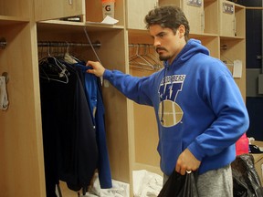 Winnipeg Blue Bombers linebacker Ian Wild cleans out his locker Monday following the team's loss to the B.C. Lions in the CFL Western semifinal. (Brian Donogh/Winnipeg Sun)