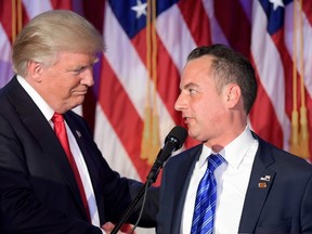 This file photo taken on November 9, 2016 shows Chairman of the Republican National Committee (RNC) Reince Priebus (R) shaking hands with Republican presidential elect Donald Trump (L) during election night at the New York Hilton Midtown in New York.
(JIM WATSON/AFP/Getty Images)