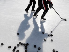 The Senators took to the ice at Jules Morin Park in Ottawa for an outdoor practice on Feb. 20, 2014. Plans for an outdoor game on Parliament Hill won't happen, so the NHL may look elsewhere -- outside Ottawa -- to host the game for the league's 100th anniversary. (Darren Brown/Postmedia/Files)