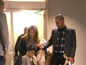 The Alkhateeb family arrives at Kingston's airport. The family includes parents Lina and Fares, son Jamal, 4, and daughter Reem, 6. (Lorraine Payette/Special to Postmedia Network)